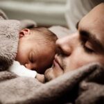 Dad and baby sleeping