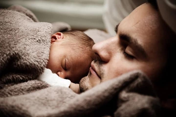 Dad and baby sleeping