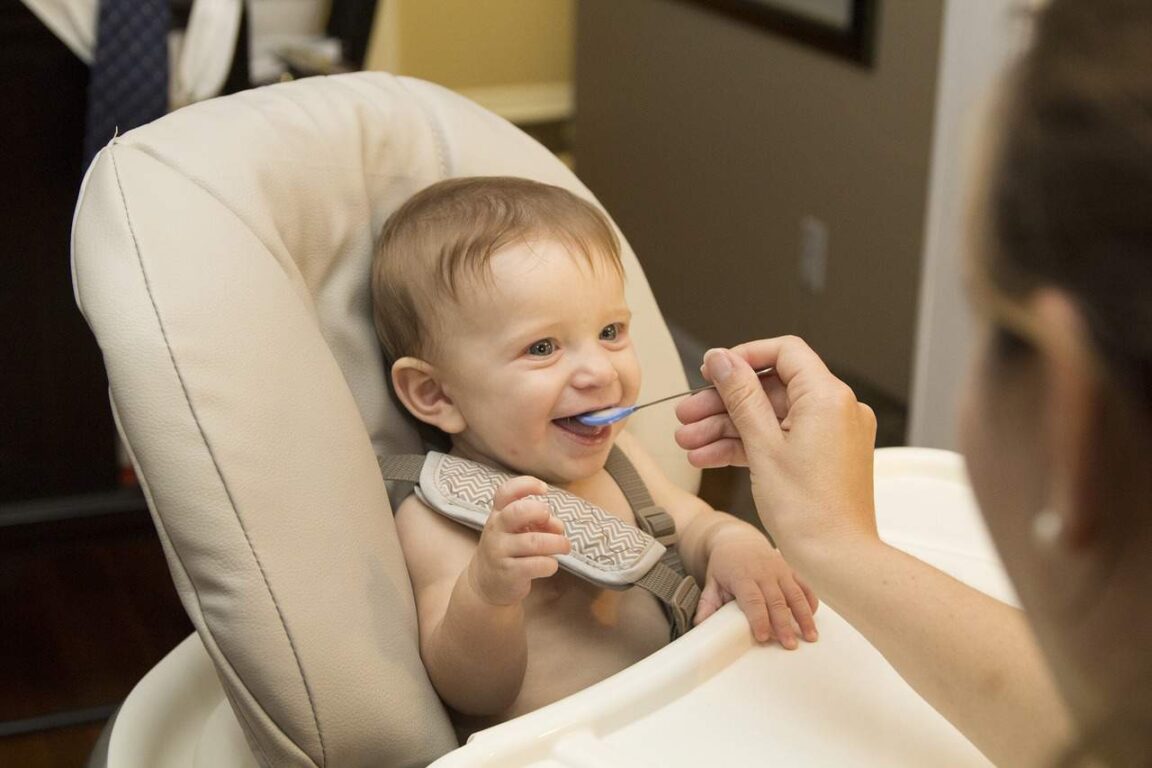 A Baby Eating First Food