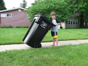 Kid taking out the trash