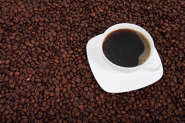 Cup of coffee and coffee beans