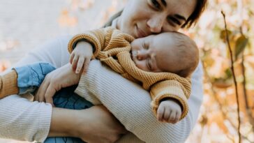 A mom holding her baby